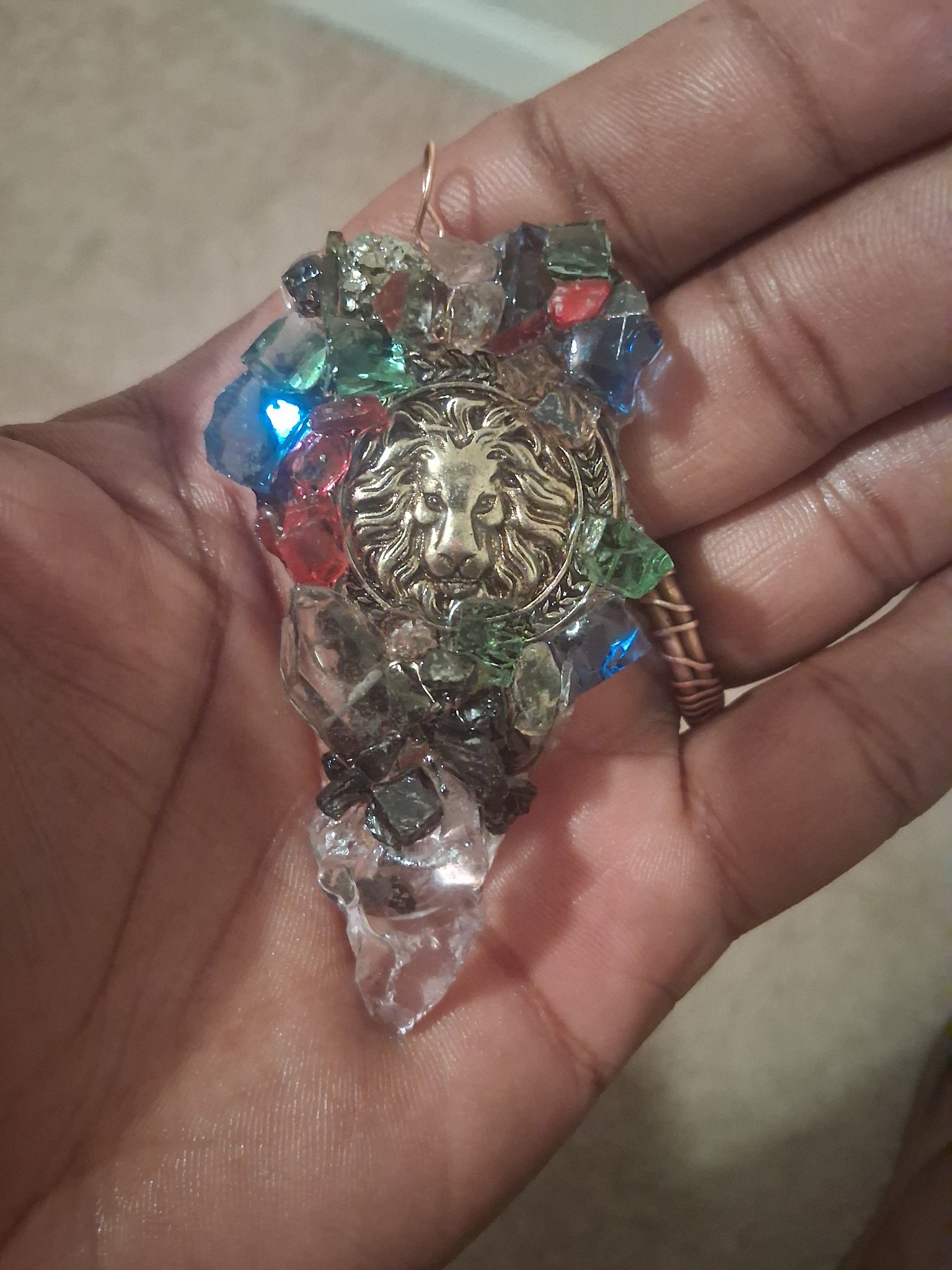 Handmade crystal pendant with a lion medallion