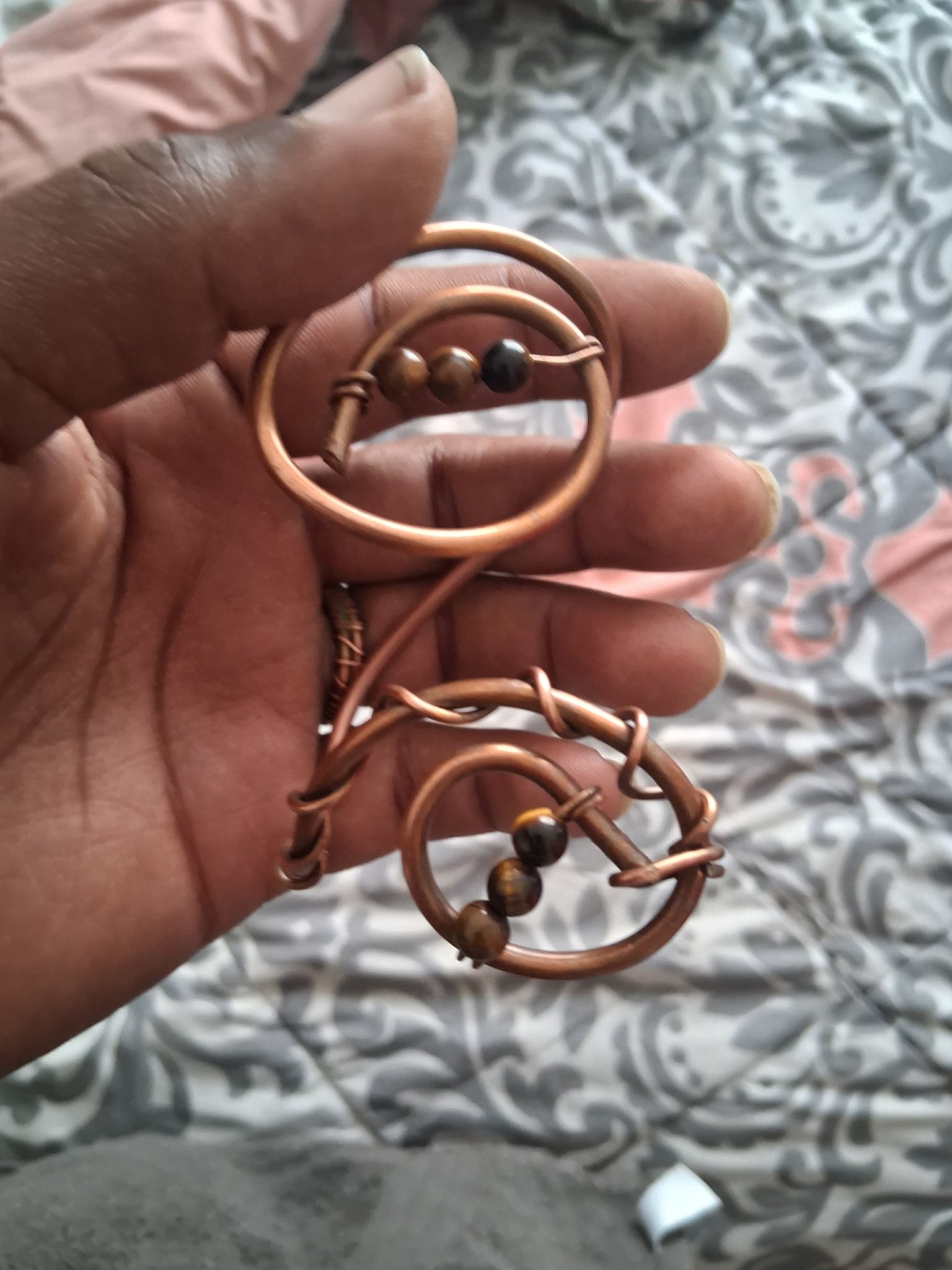 Sculptural handmade copper bracelet with small polished stone beads