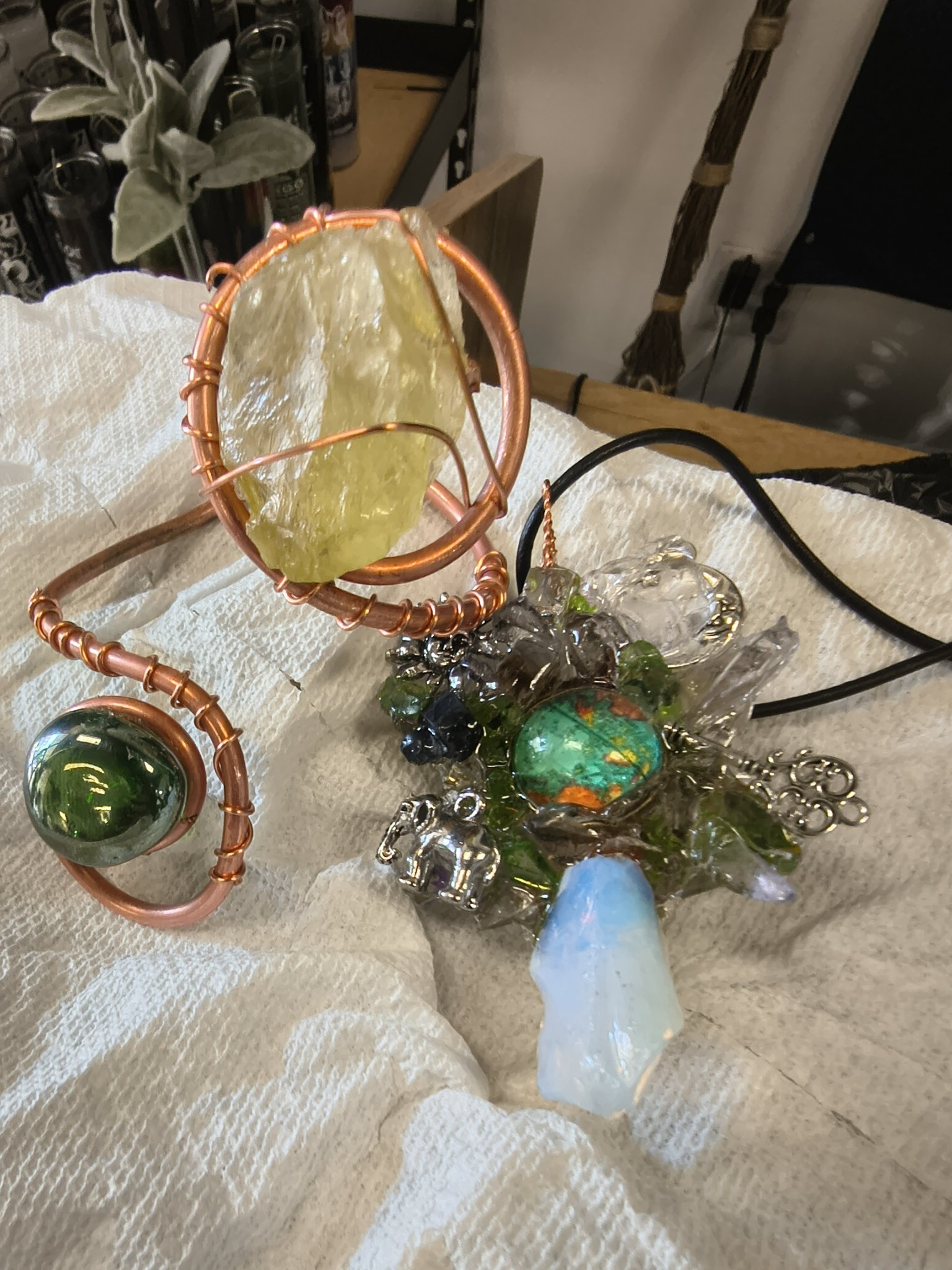 Handmade copper wire-wrapped crystal piece with colorful glass details